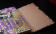 картинка Гостевая книга Paperblanks Sequined Garnet (в линейку), Guest (23х18см), цветная от магазина Молескинов